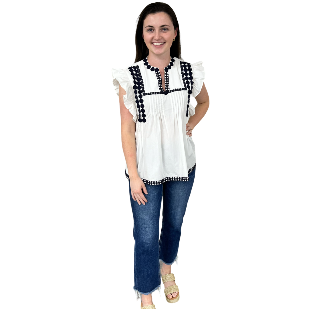 The Huntley White Flutter Sleeve Top with Navy Crochet Trim — view 6