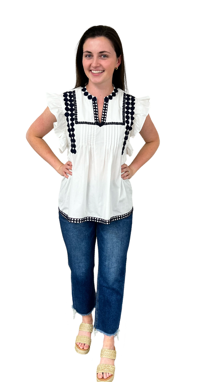 The Huntley White Flutter Sleeve Top with Navy Crochet Trim