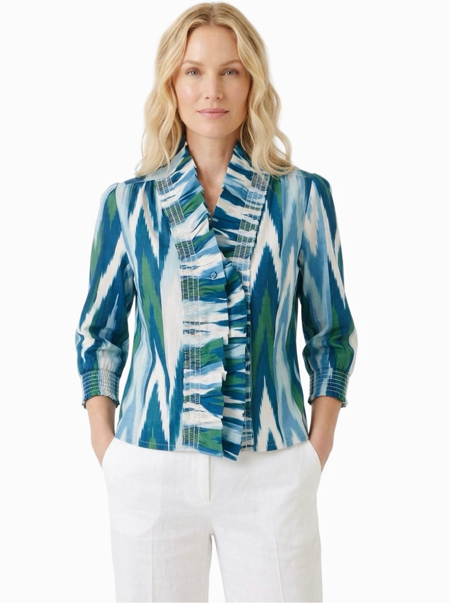 The Amelia Ruffle Front Smocked Top in Green Blue Geometric Ikat — view 2