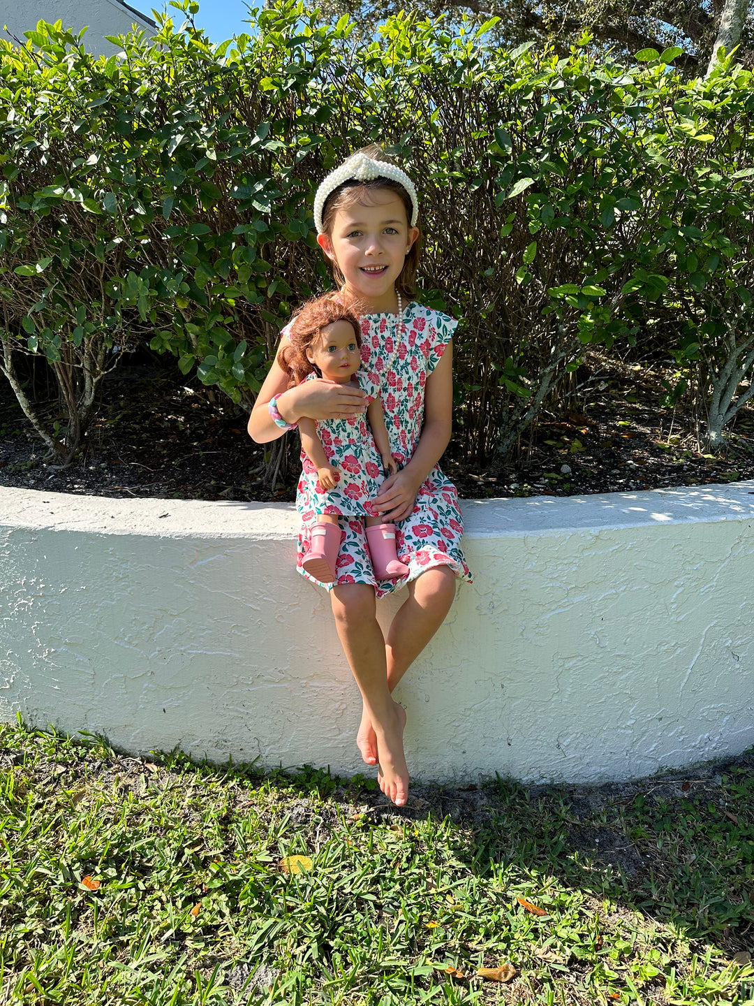 The Cloey Smocked Girl’s Dress in White and Pink Floral — view 3